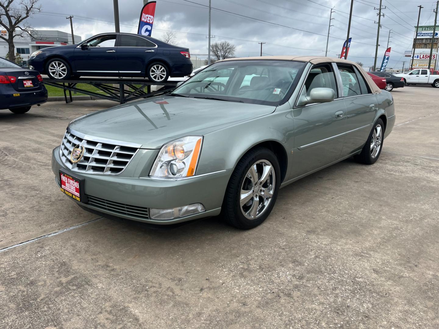 2006 green /TAN Cadillac DTS Sedan (1G6KD57Y96U) with an 4.6L V8 DOHC 32V engine, 4-Speed Automatic Overdrive transmission, located at 14700 Tomball Parkway 249, Houston, TX, 77086, (281) 444-2200, 29.928619, -95.504074 - Photo#2